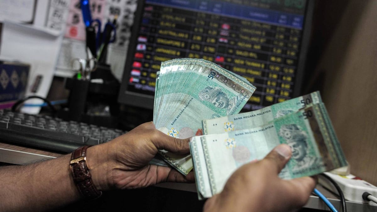 Malaysia's currency woes spur financial stress, political discontent. Will the ringgit rise again?