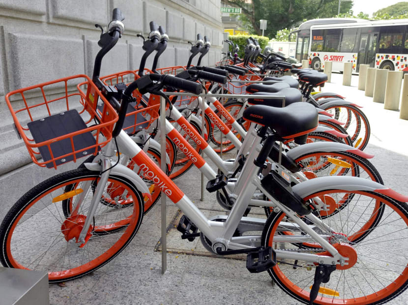 Bicycle-sharing firm Mobike is rolling out 1,000 parking areas designated for its orange bikes by year end. TODAY file photo