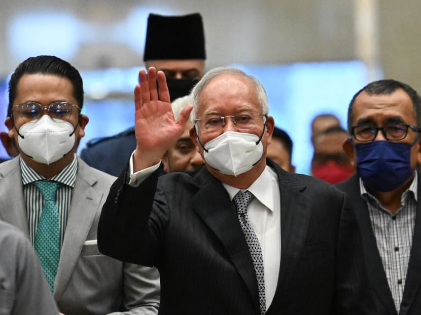 Malaysia's former prime minister Najib Razak waves as he arrives at the federal court in Putrajaya on Aug 23, 2022.
