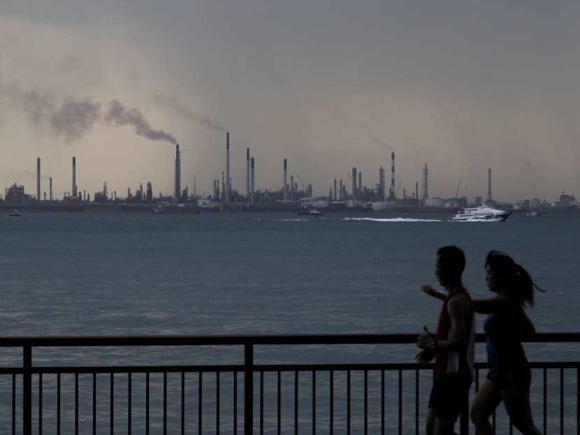 Large emitters of greenhouse gases will be taxed S$5 for every tonne of gas they release into the air between next year and 2023. TODAY file photo