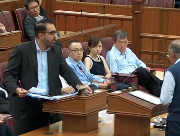 Mr Pritam Singh (left), Leader of the Opposition, debating with Law Minister K Shanmugam (right) in Parliament on Nov 29, 2022.