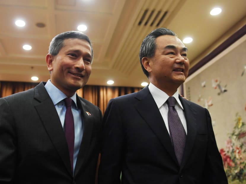 Singapore's Foreign Minister Vivian Balakrishnan (L) walks with Chinese Foreign Minister Wang Yi before a meeting at the Ministry of Foreign Affairs in Beijing, China on June 12, 2017.  Photo: Reuters