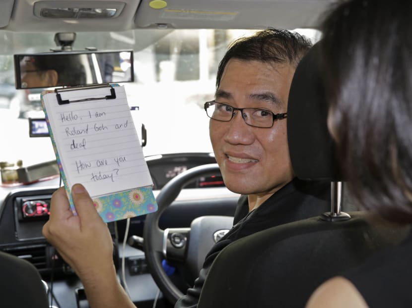 Mr Roland Goh is a hearing impaired Uber driver. Photo: Wee Teck Hian/TODAY