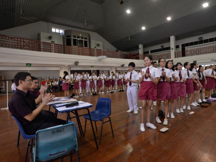 Students of Damai Secondary School, one of 11 pairs of secondary schools that will be merged in the next two years. Photo: Robin Choo/TODAY