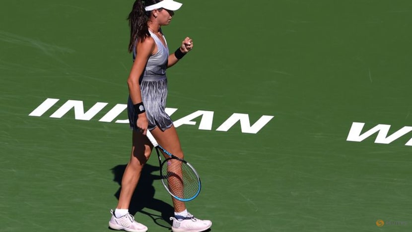 Defending champ Andreescu holds off Riske in Indian Wells return Defending champ Andreescu holds off Riske in Indian Wells return