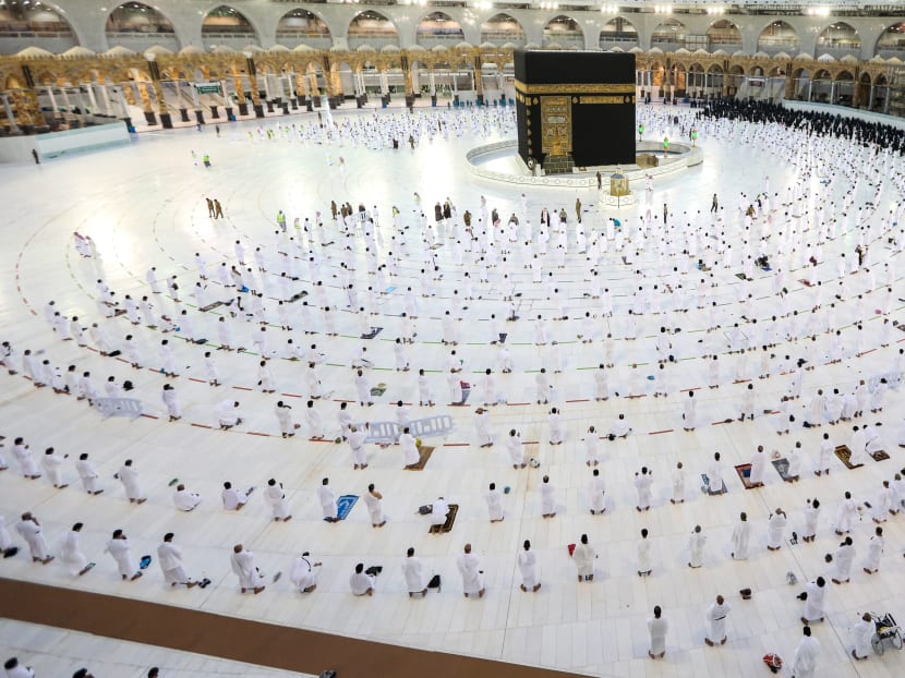 Muslim worshippers pray around the Kaaba in the Grand Mosque complex, Islam's holiest shrine, in Saudi Arabia's holy city of Mecca on Nov 1, 2020.