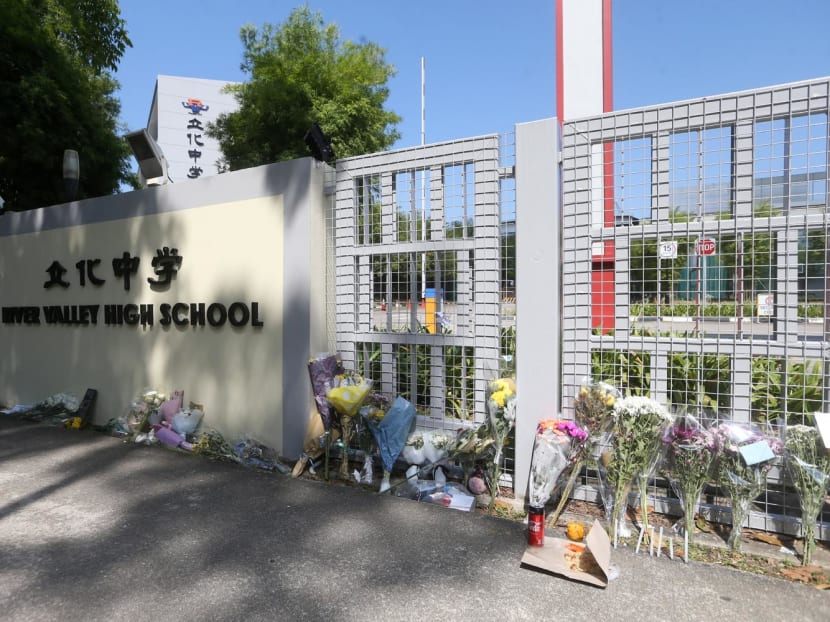 Bouquets of flowers seen at the main gate of River Valley High School on July 25, 2021.