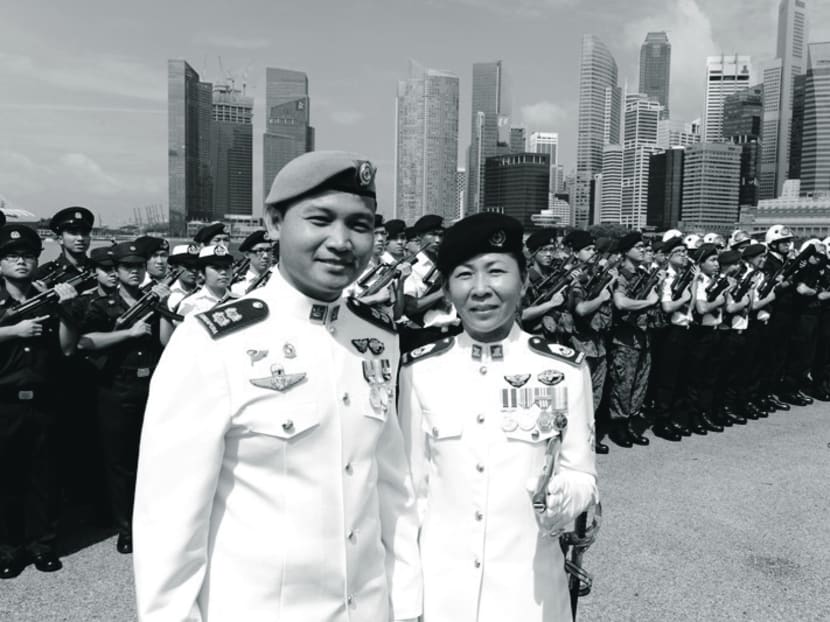 MWO Jennifer Tan (right) was Singapore’s first female Regimental Sergeant-Major at the 2011 National Day Parade. Singapore’s achievement in allowing women into combat 
roles has been praised by experts. Photo: MINDEF
