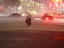 A man makes his way through flooded area during heavy rain in Seoul, South Korea, Aug 8, 2022. 