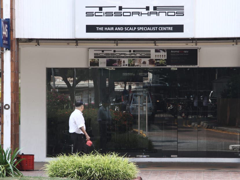 A man outside the shuttered The Scissorhands Salon in Clementi. Photo: Daryl Kang/TODAY
