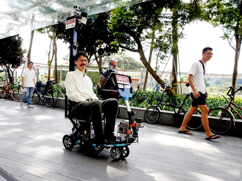 NUS Associate Professor Marcelo Ang using the self-driving electric scooter in a demonstration yesterday. Its features include the ability to slow down when it detects obstacles up to 2.5m in front of it. Photo: Koh Mui Fong/TODAY