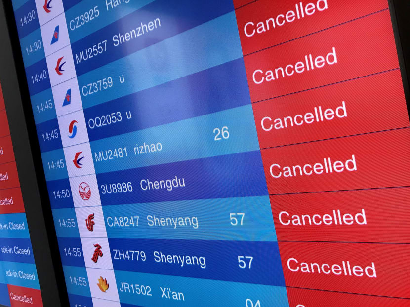 A screen shows on Jan 23, 2020, cancelled flights at Tianhe airport in Wuhan, China's central Hubei province, as the authorities had banned trains and planes from leaving the city.