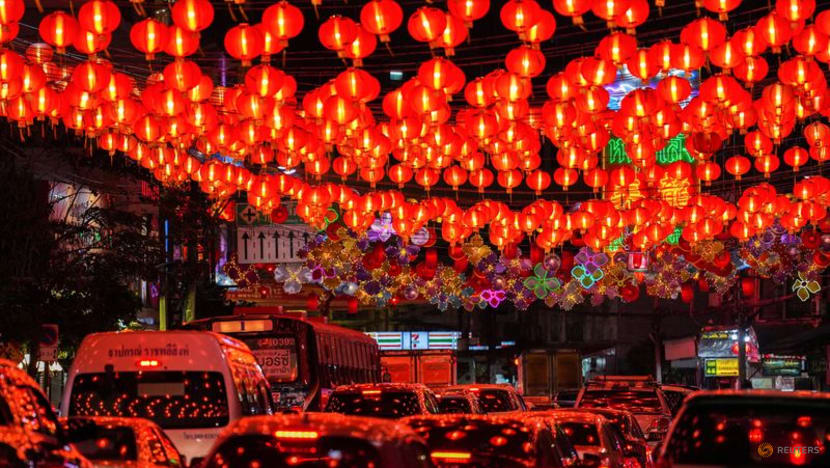 For Chinese Lunar New Year tourists, retailers roll out rabbit dances, red lanterns