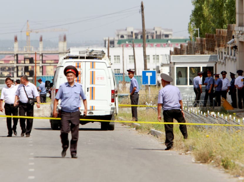 Interior Ministry officers and  security forces sealing the site of the bomb blast outside China’s embassy in Kyrgyzstan. Photo: REUTERS