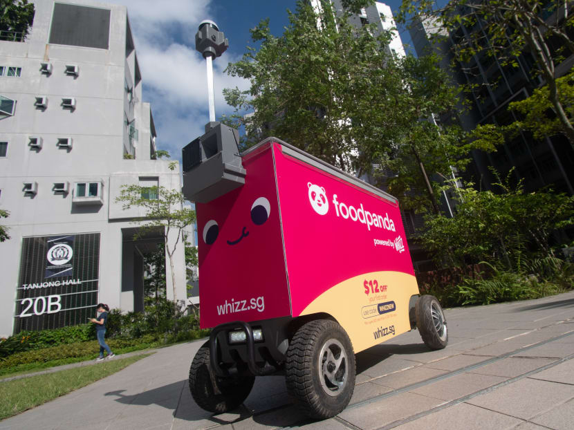 Students across the campus of Nanyang Technological University now receive all their Foodpanda deliveries from any of the four bright pink robots (pictured) also known as FoodBots. Students across the campus of Nanyang Technological University now receive all their Foodpanda deliveries from any of the four bright pink robots (pictured) also known as FoodBots.
