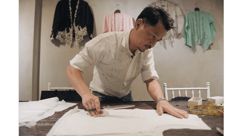 Defiantly, he weaves life into a dying Peranakan craft