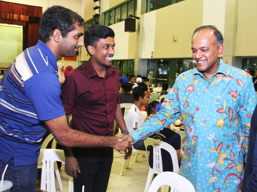 Law and Home Affairs Minister K Shanmugam (wearing light blue) mingle with the residents of Chong Pang at Chong Pang Community Club on June 18, 2016. Photo: Damien Teo