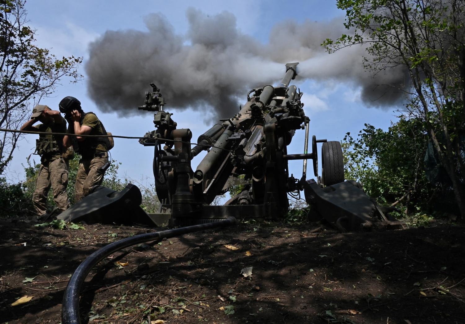 Ukrainian gunmen fire a US made M777 howitzer from their position on the front line in Kharkiv region on Aug 1, 2022, amid Russia's military invasion launched on Ukraine. Ukrainian gunmen fire a US made M777 howitzer from their position on the front line in Kharkiv region on Aug 1, 2022, amid Russia's military invasion launched on Ukraine.