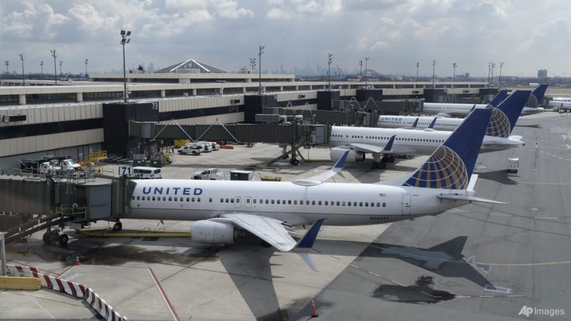 United Airlines passenger arrested after opening door, walking on wing of plane as jet taxis