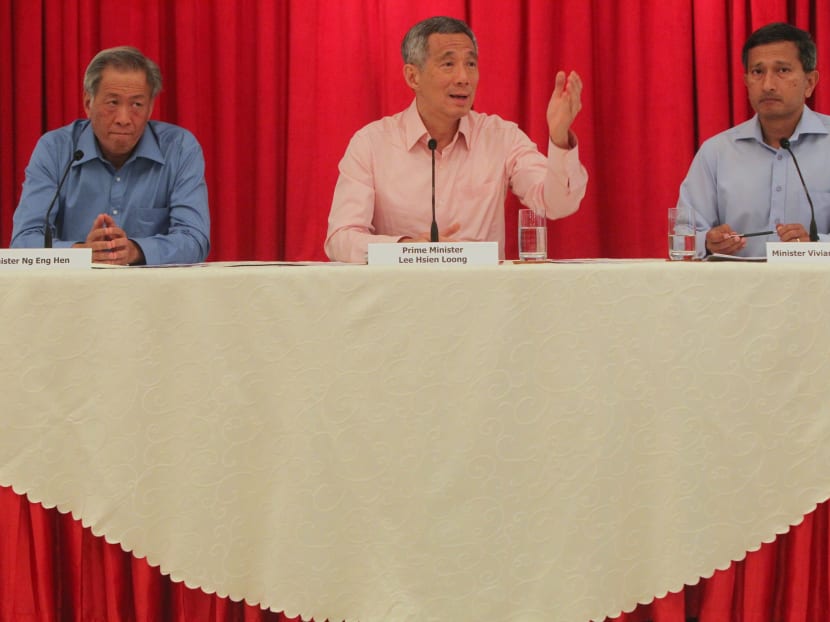 Minister Ng Eng Hen, PM Lee Hsien Loong and Minister Vivian Balakrishnan at the haze situation press conference at Istana. Photo: Don Wong