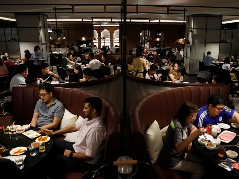 Diners at a Singapore restaurant on Nov 13, 2020. The author says that one should not reject an offer of a treat by a less well-off person as it helps to restore some self-dignity for the person.
