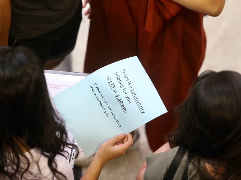 Students affected by the theft of the GCE A-Level H2 Chemistry paper 3 examination scripts were given a slip of paper informing them of a briefing. Photo: Koh Mui Fong/TODAY Students affected by the theft of the GCE A-Level H2 Chemistry paper 3 examination scripts were given a slip of paper informing them of a briefing. Photo: Koh Mui Fong/TODAY