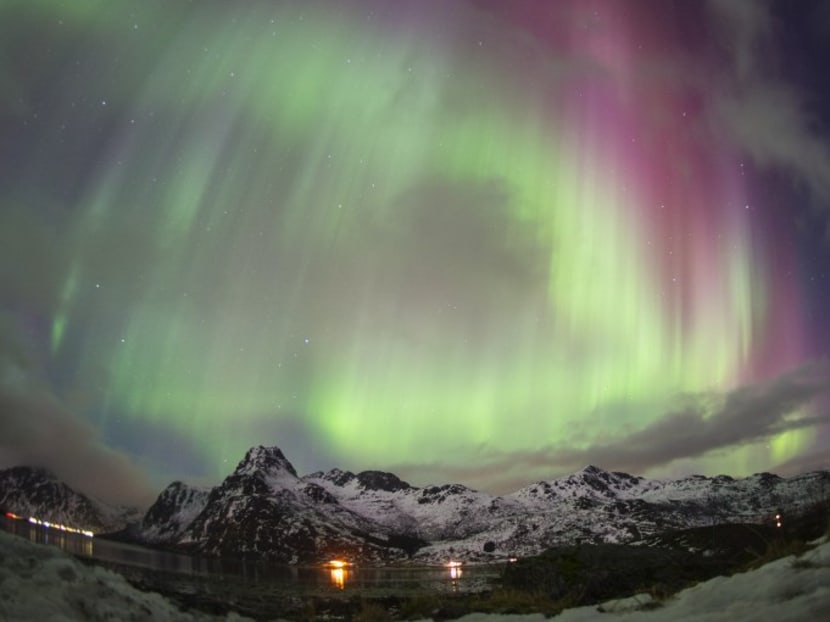 Northern lights illuminate the sky on Lofoten Islands, Arctic Circle, on March 14, 2016. Photo: AFP