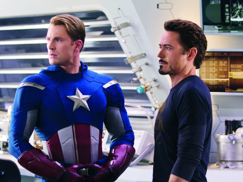 Captain America (Chris Evans) and Tony Stark (Robert Downey Jr.) in a scene from The Avengers.