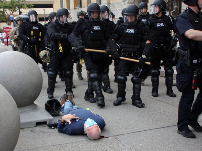 Martin Gugino, a 75-year-old protester, lays on the ground after he was shoved by two Buffalo, New York, police officers during a protest against the death in Minneapolis police custody of George Floyd in Niagara Square in Buffalo, New York, U.S, June 4, 2020.