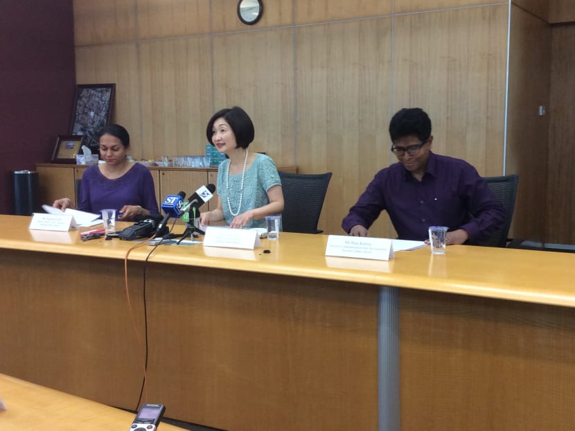 NLB CEO Elaine Ng (centre) holding a press conference, July 18 2014.
