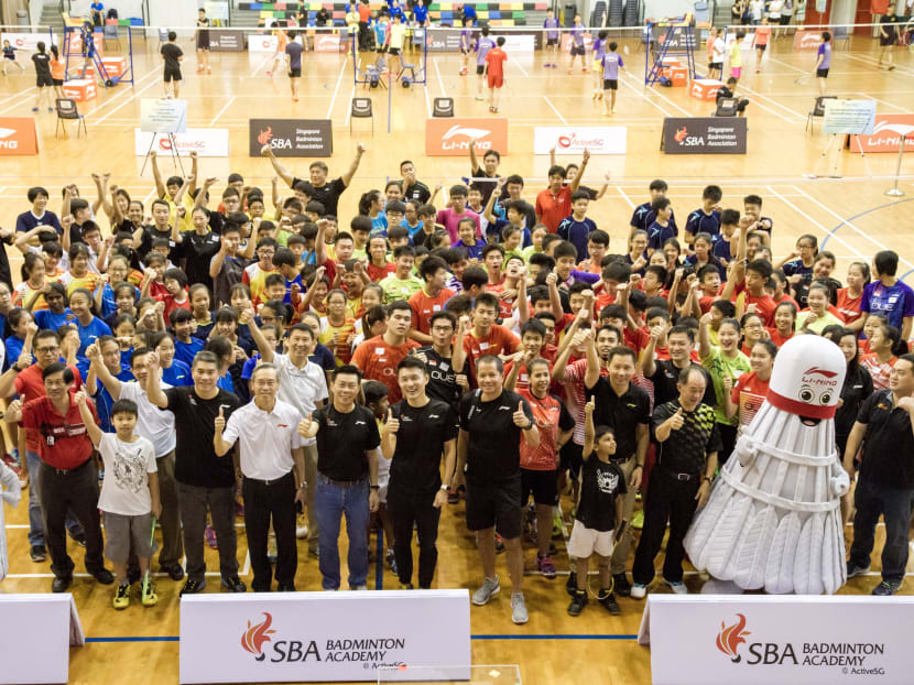MCCY Parliamentary Secretary BaeyYam Keng with former SBA president Lee Yi Shyan and national team players and players from various schools at the launch of the SBA Badminton Academy @ ActiveSG at Pari Ris Sports Hall on Saturday. Photo: Dyan Tjhia