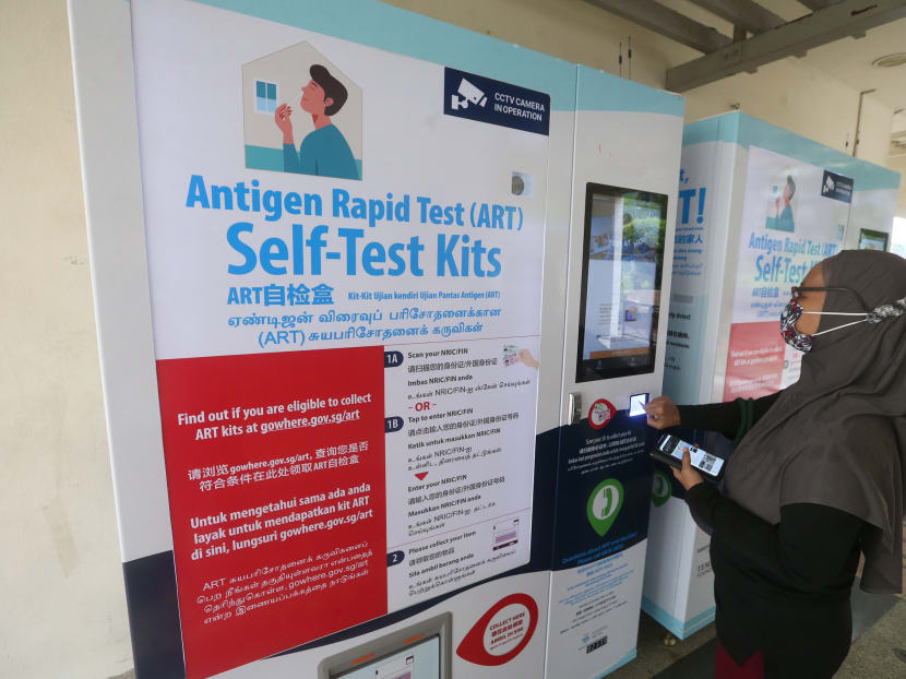 Two vending machines dispensing antigen rapid test kits at Block 363 Woodlands Avenue 5, outside Woodgrove Zone 8 Residents' Committee, on Sept 19, 2021.