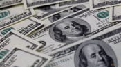 Dollar edges up as darkening growth outlook hurts sentiment