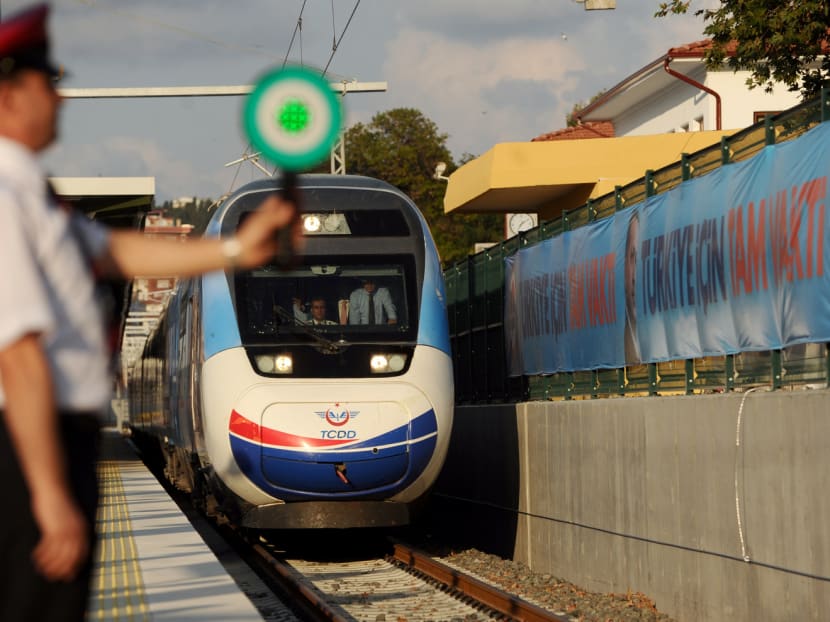 The first Turkish high-speed train arriving at Pendik railway station, in Istanbul, during the high-speed train opening ceremony in 2014. The total estimated value of 18 Chinese overseas high-speed rail schemes amounts to US$143 billion (S$196 billion). Photo: AFP