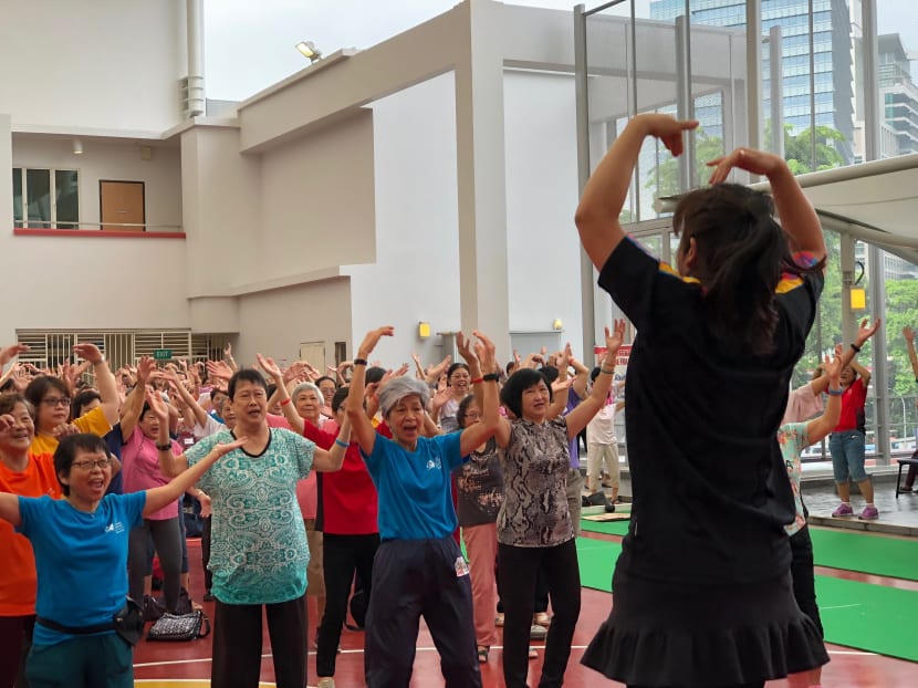 Seniors taking part in a mass workout session at the Active Ageing Health Carnival on Sunday (Oct 8). Photo: Raymond Tham/TODAY