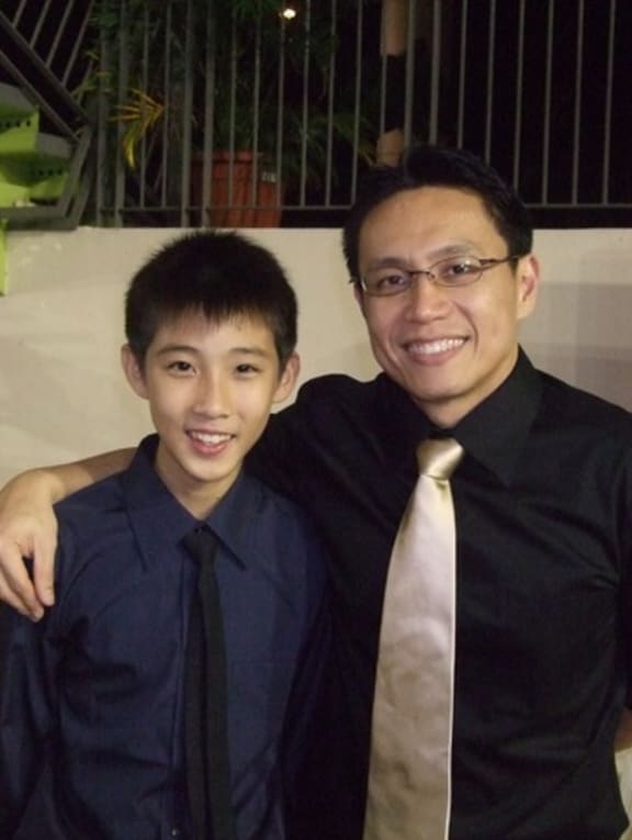 Loh Kean Yew pictured in 2010 at the age of 10 with Mr Desmond Tan, general manager of the Singapore Sports School's Badminton Academy. 