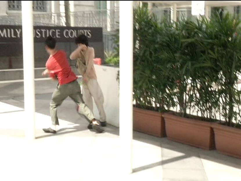 As ‪‎Amos Yee‬ was making his way into court for his pre-trial conference, a stranger came up and slapped him in the face. Photo: Channel NewsAsia