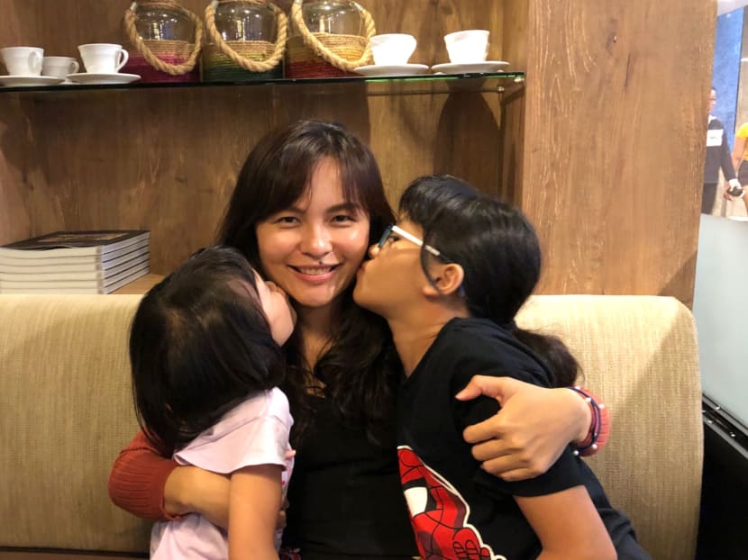 The author, seen here with her daughters during Mothers' Day in 2019, suffered parenting burnout and contemplated suicide.