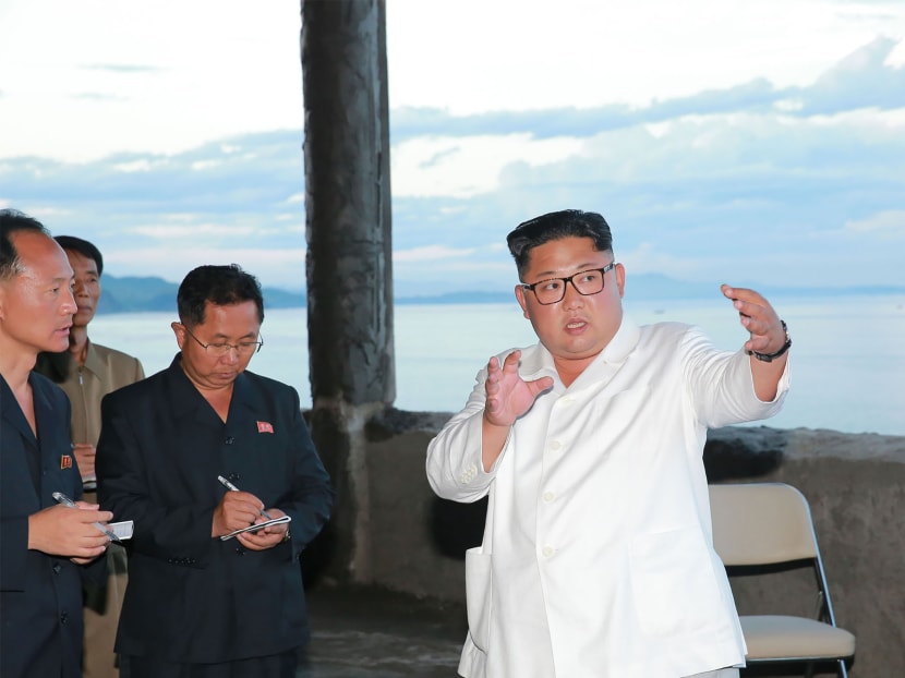 This undated picture released by North Korea's official Korean Central News Agency (KCNA) on July 17, 2018 via KNS shows North Korean leader Kim Jong-un inspecting the Yombunjin Hotel under construction in North Hamgyong Province.