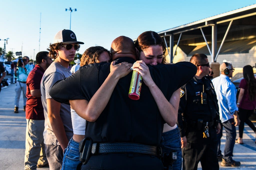 People mourn as they attend a vigil for the victims of the mass shooting at Robb Elementary School in Uvalde, Texas on May 25, 2022. People mourn as they attend a vigil for the victims of the mass shooting at Robb Elementary School in Uvalde, Texas on May 25, 2022.