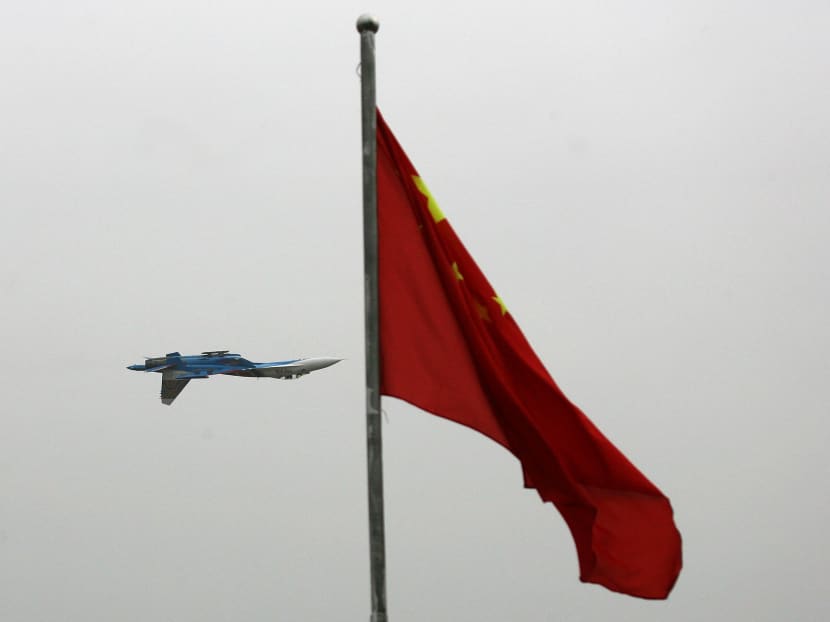 A Su-27 fighter jet flies near Tianmenshan National Park, China. General Yi Xiaoguang, a versatile pilot who has flown the Su-27, has been named to head a military theatre command, signalling the air force’s growing strategic importance in the People’s Liberation Army. Photo: Reuters