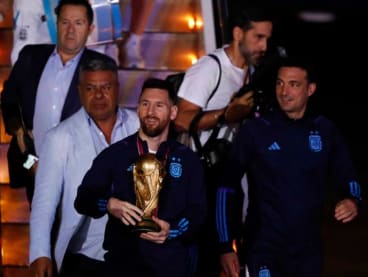 Argentine captain Lionel Messi with the World Cup trophy during the team's arrival at Ezeiza International Airport at Buenos Aires, Argentina.