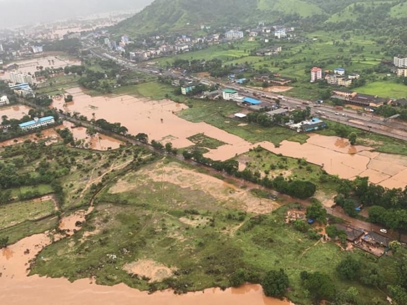 Areas inundated with flood water after heavy monsoon rains are seen in the Raigad district of Maharashtra in this handout photo by the Indian Navy.