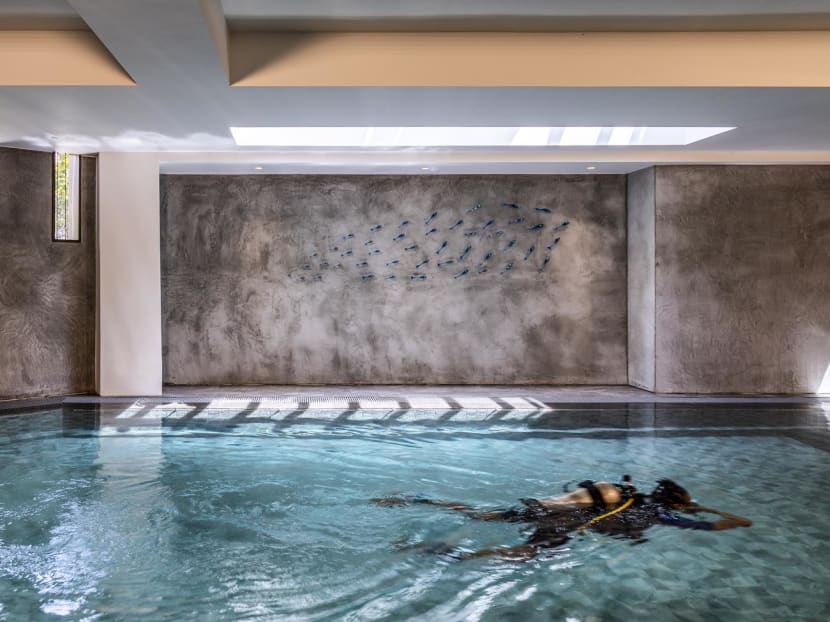 A heated pool in the basement of this Singapore home serves as the ‘office’ for its owners A heated pool in the basement of this Singapore home serves as the ‘office’ for its owners