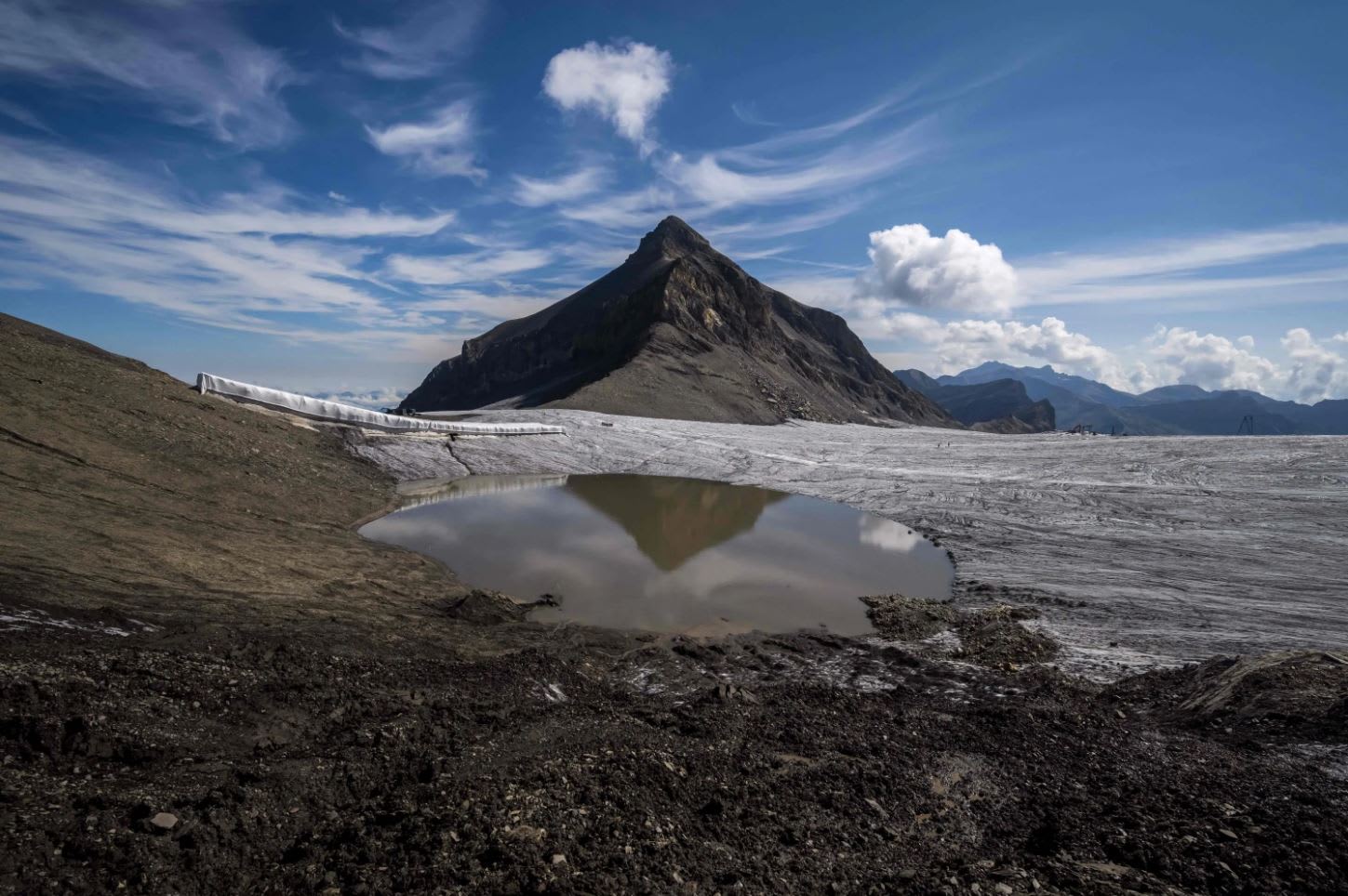 A picture taken on Aug 6, 2022, shows The Oldenhorn mountain next to the melting Tsanfleuron Glacier above Les Diablerets, Switzerland. A picture taken on Aug 6, 2022, shows The Oldenhorn mountain next to the melting Tsanfleuron Glacier above Les Diablerets, Switzerland.