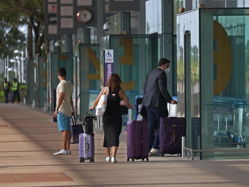 File photo of travellers at Changi Airport Terminal 3 on Oct 19, 2021.