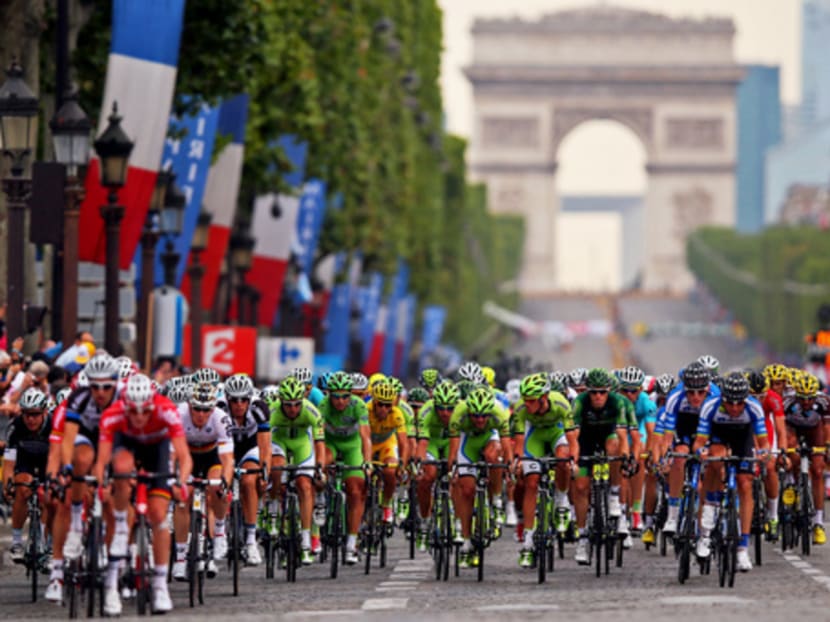The peloton riding down the Champs Elysees in Paris at last year’s Tour de France. To this day, no one has been caught with a motor on his bicycle. But it is increasingly obvious that the technology exists, if a rider or team were that way inclined. Photo: Getty Images