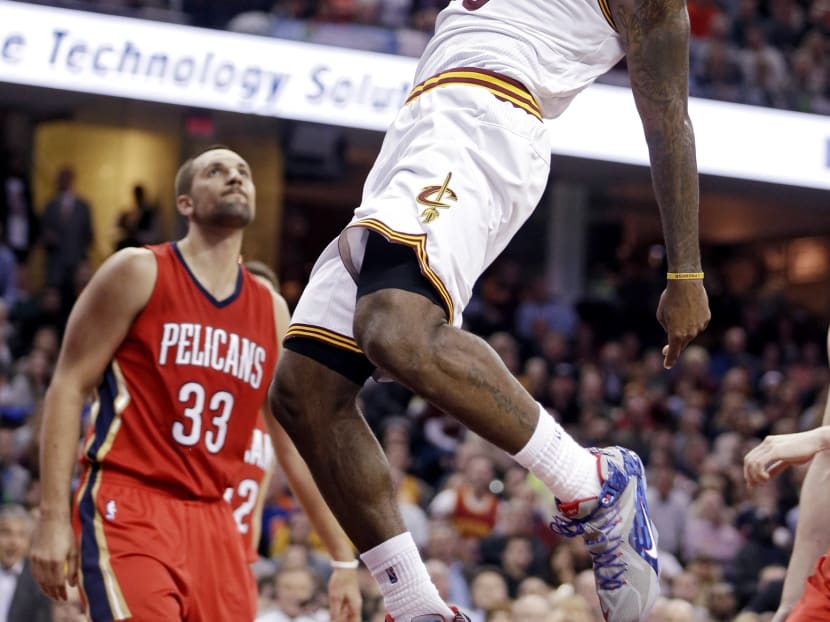 Cleveland’s LeBron James dunking against the New Orleans Pelicans in his tribute to their fans. Photo: AP