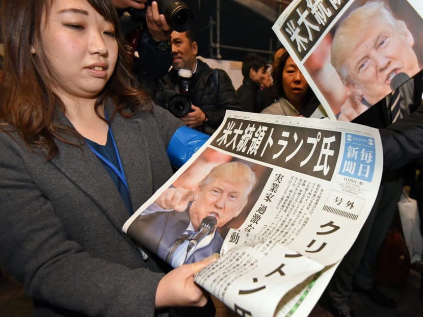 A Japanese newspaper reporting on Mr Trump’s win in the US presidential election yesterday. Asian leaders greeted Mr Trump’s victory cautiously, expressing hopes of continued engagement with the new US administration. Photo: AFP