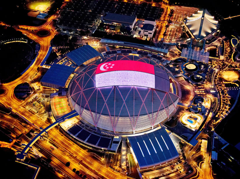 The Singapore Sports Hub glowing at night with activity. Photo: Sport Singapore